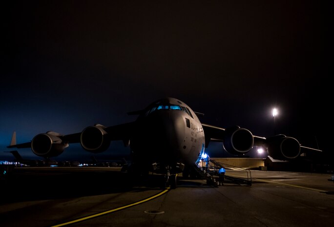 Staff Sgt. Ryan Tobkin and Staff Sgt. Ryan Jordan, 437th Aircraft Maintenance Squadron electronic warfare systems technicians, replace the infrared countermeasure housing on a C-17 Globemaster III March 3, 2014, at Joint Base Charleston – Air Base, S.C. The infrared countermeasure is used to stop homing missiles or devices from striking the aircraft. (U.S. Air Force photo/ Senior Airman Dennis Sloan)