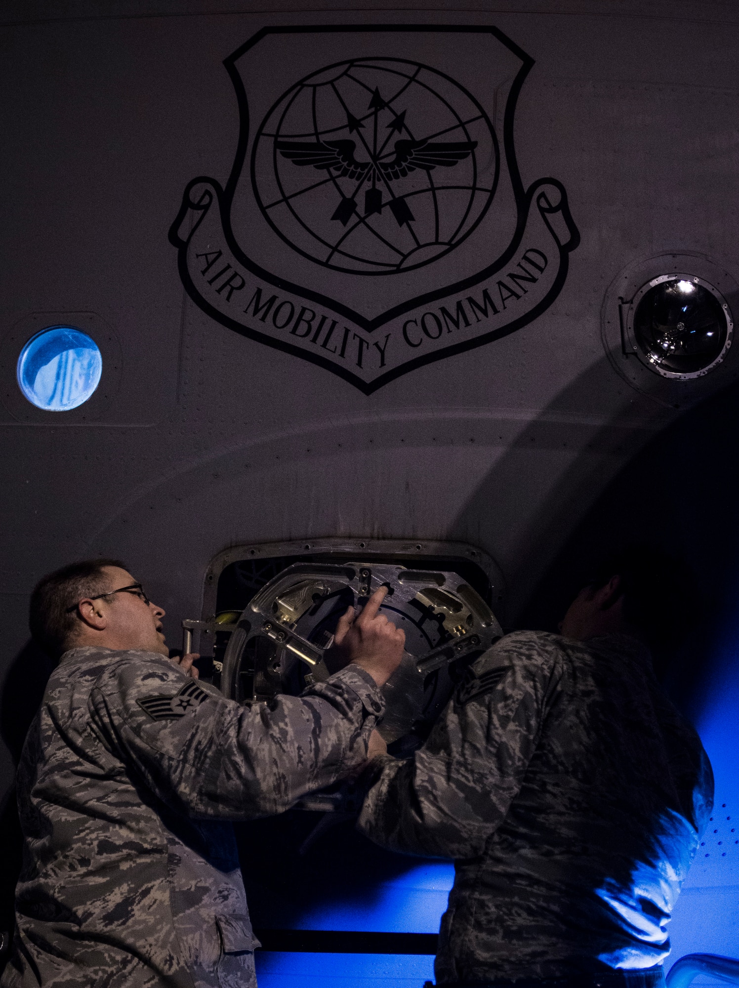 Staff Sgt. Ryan Tobkin and Staff Sgt. Ryan Jordan, 437th Aircraft Maintenance Squadron electronic warfare systems technicians, replace the infrared countermeasure housing on a C-17 Globemaster III March 3, 2014, at Joint Base Charleston – Air Base, S.C. The infrared countermeasure is used to stop homing missiles or devices from striking the aircraft. (U.S. Air Force photo/ Senior Airman Dennis Sloan)