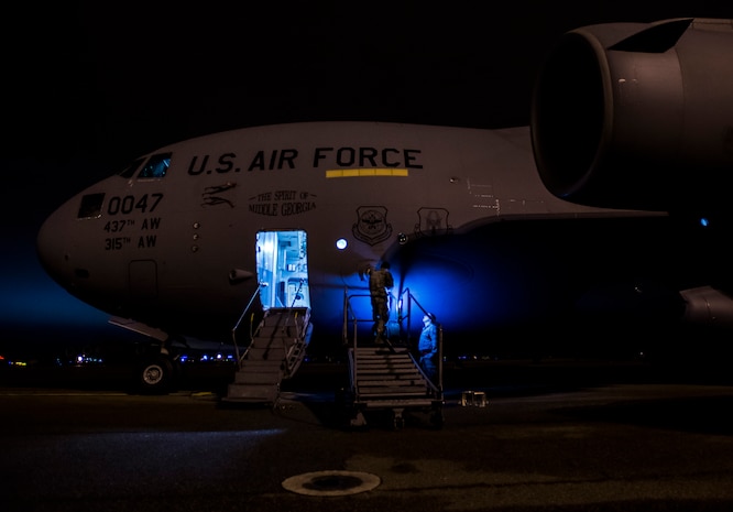 Staff Sgt. Ryan Tobkin and Staff Sgt. Ryan Jordan, 437th Aircraft Maintenance Squadron electronic warfare systems technicians, replace the infrared countermeasure housing on a C-17 Globemaster III March 3, 2014, at Joint Base Charleston – Air Base, S.C. The infrared countermeasure is used to stop homing missiles or devices from striking the aircraft. (U.S. Air Force photo/ Senior Airman Dennis Sloan)