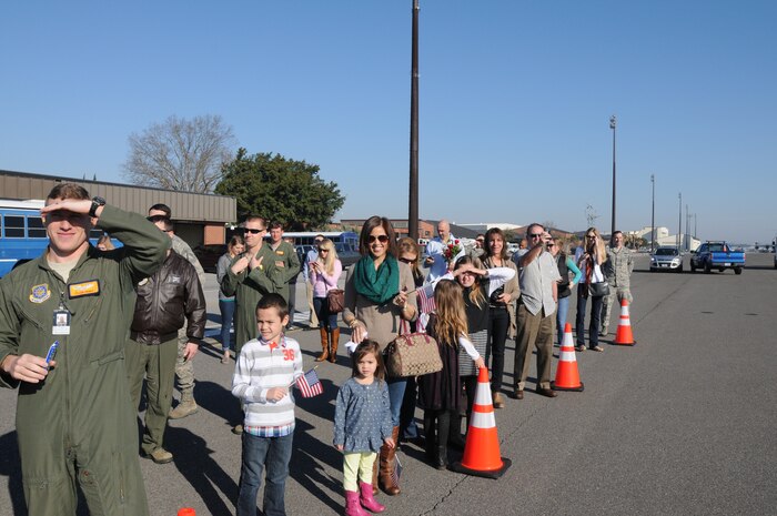 Friends and family of the deployed members of the 16th Airlift Squadron wait for their loved ones to exit a C-17 Globemaster III following a 60-day deployment March 2, 2014, at Joint Base Charleston — Air Base, S.C. The Airmen conducted combat operations in support of OEF while deployed with the 816th Expeditionary Airlift Squadron. (U.S. Air Force photo/Capt. Sean Perry)