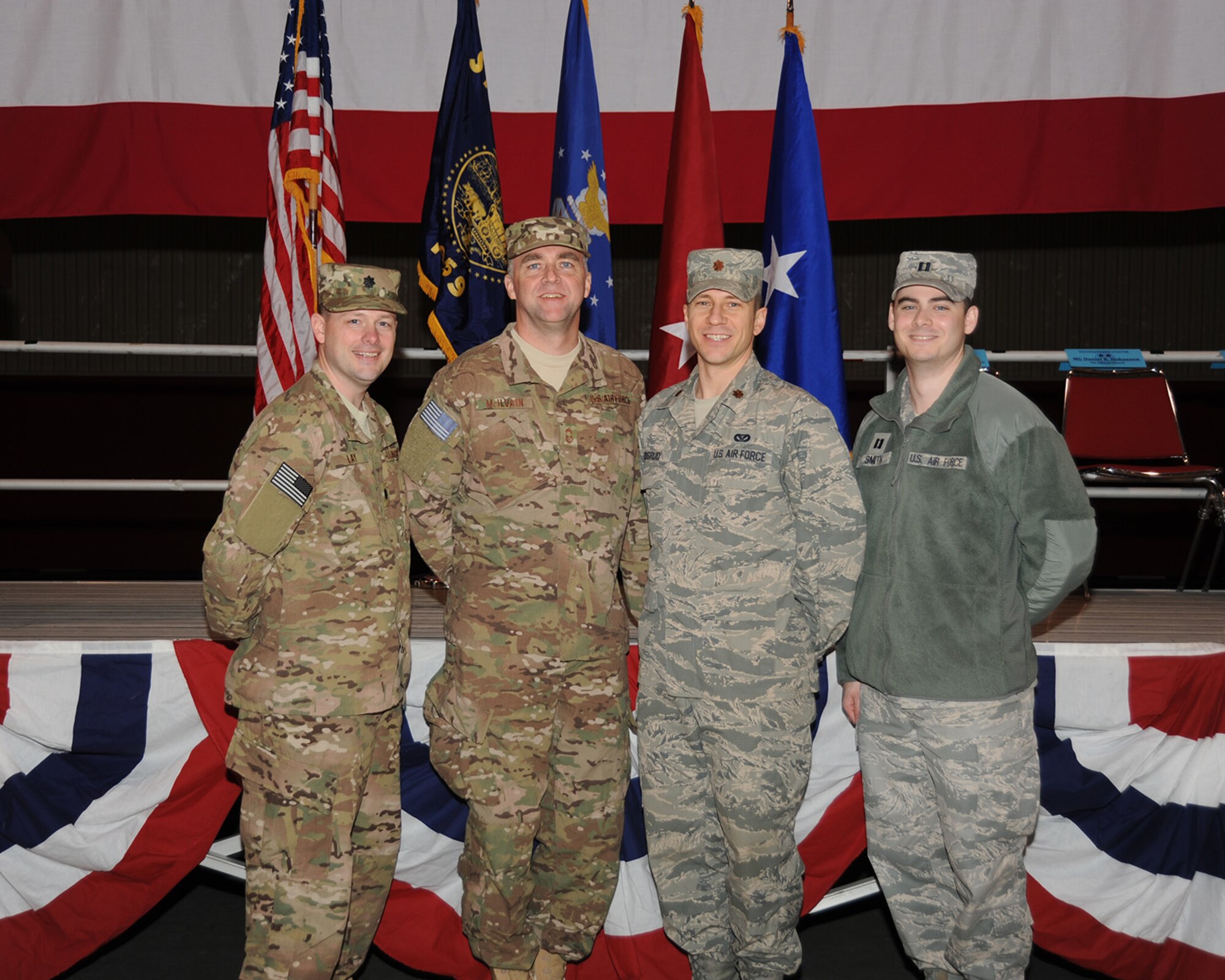 Members of the 142nd Civil Engineer Squadron leadership pose for a group picture following the mobilization ceremony held and the Portland Air National Guard Base, Ore., March 1. From left to right; Lt Col. Jason Lay, Chief Master Sgt. John McIlvain, Maj. Jacob Skugrud, and Capt. Luke Smith. (Air National Guard photo by Master Sgt. Shelly Davison, 142nd Fighter Wing Public Affairs/Released)