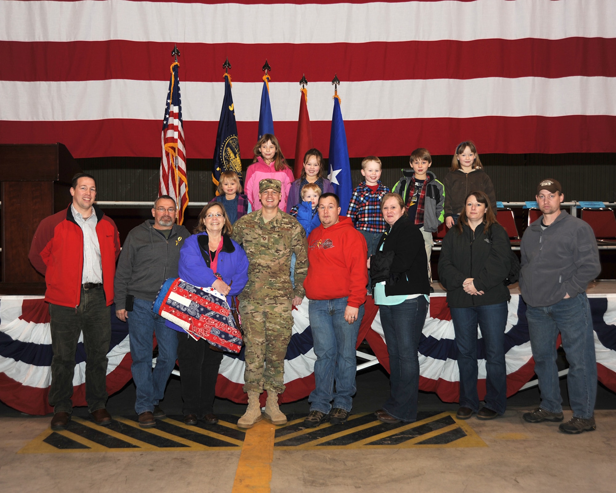 Staff Sgt. Tyler Wilson is surrounded by his family and friends following the mobilization ceremony held at the Portland Air National Guard Base, Ore., March 1. (Air National Guard photo by Master Sgt. Shelly Davison, 142nd Fighter Wing Public Affairs/Released)