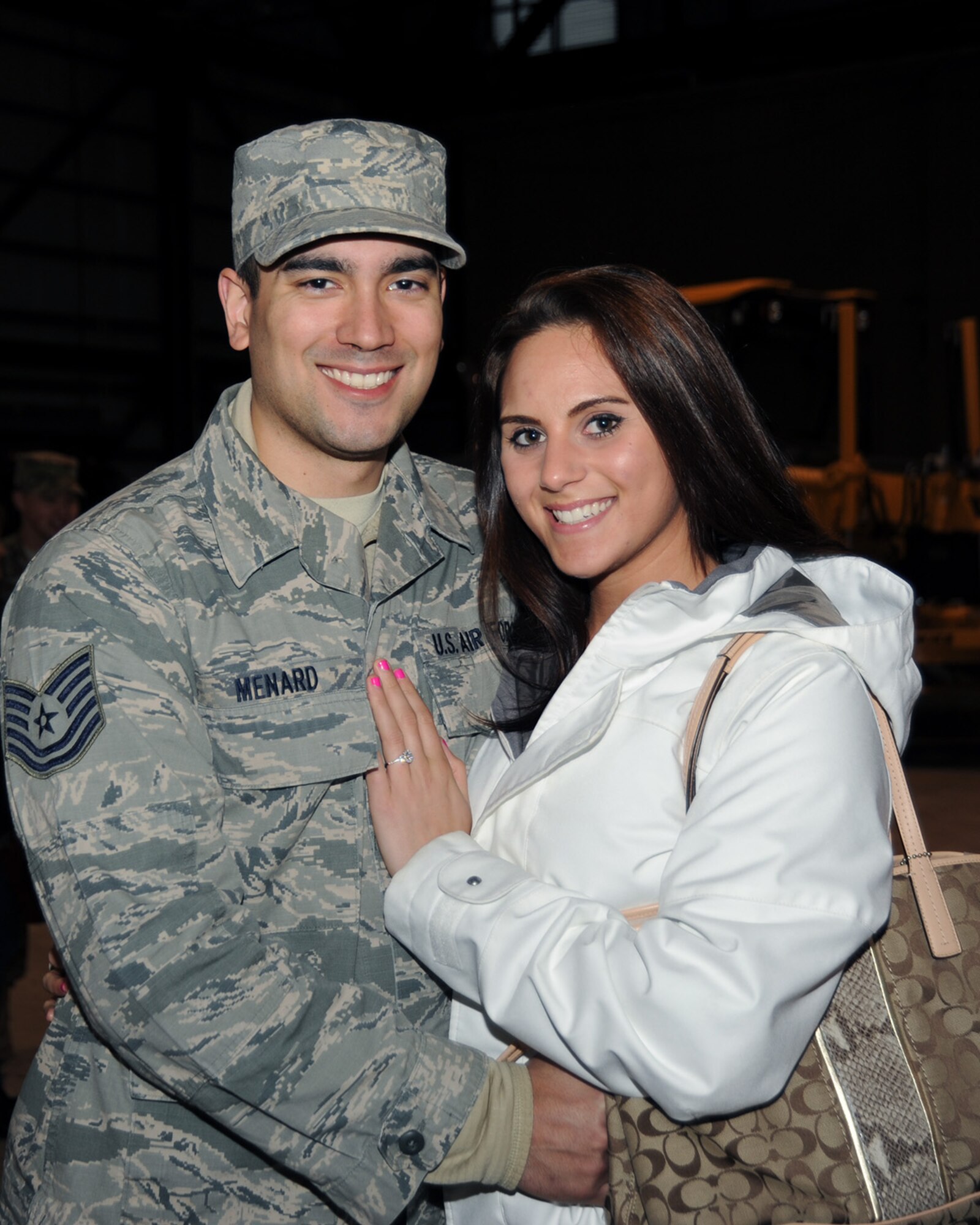 Tech. Sgt. Nicholas Menard poses with his fiancée following the mobilization ceremony held at the Portland Air National Guard Base, Ore., March 1. (Air National Guard photo by Master Sgt. Shelly Davison, 142nd Fighter Wing Public Affairs/Released)