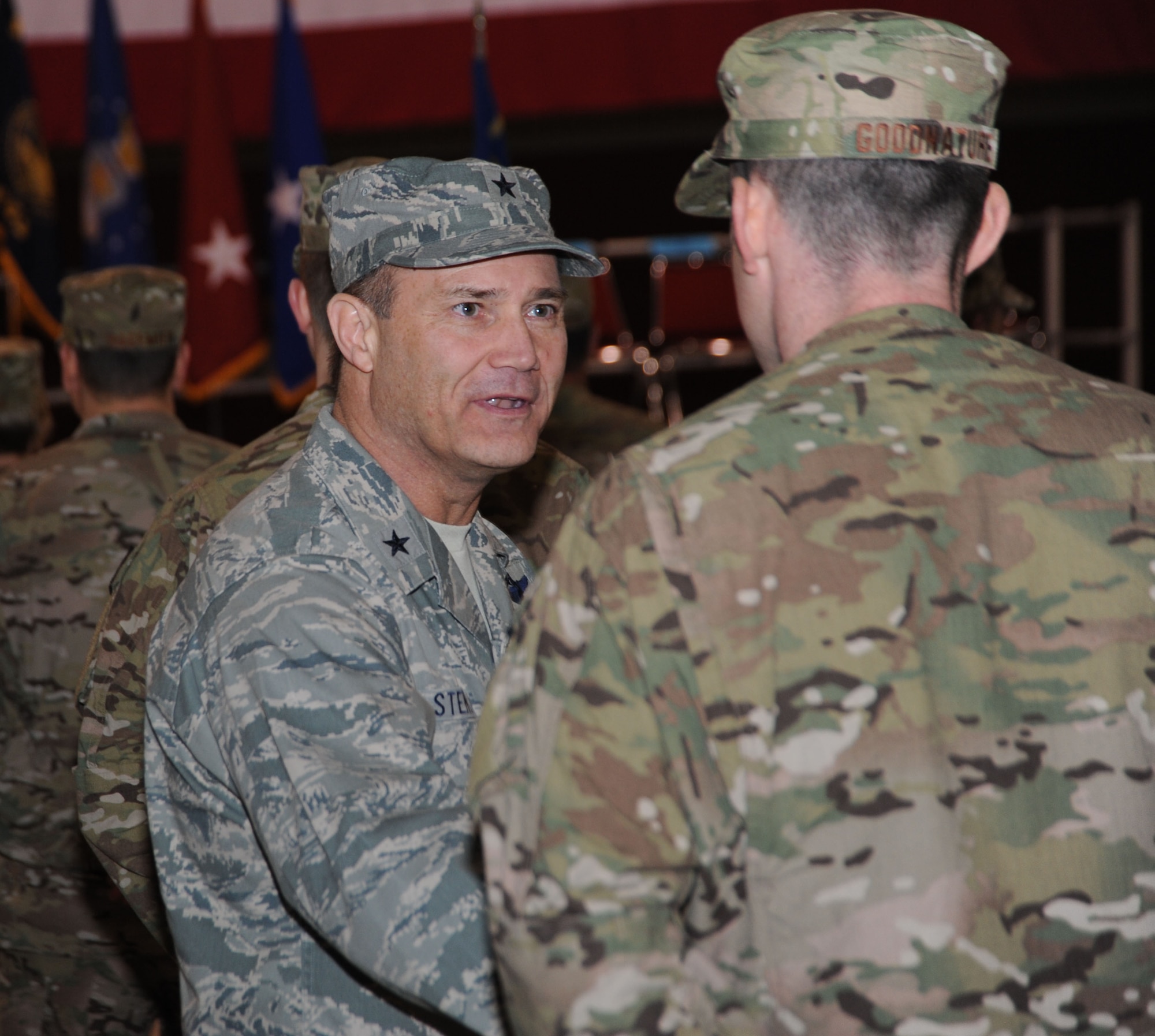 Brig. Gen. Michael Stencel, Oregon Air Guard Commander, greets members of the 142nd CES, after a formal ceremony for their upcoming mobilization held at the Portland Air National Guard Base, Ore., March 1. (Air National Guard Photo by Tech. Sgt. Aaron Perkins, 142nd Fighter Wing Public Affairs/Released)