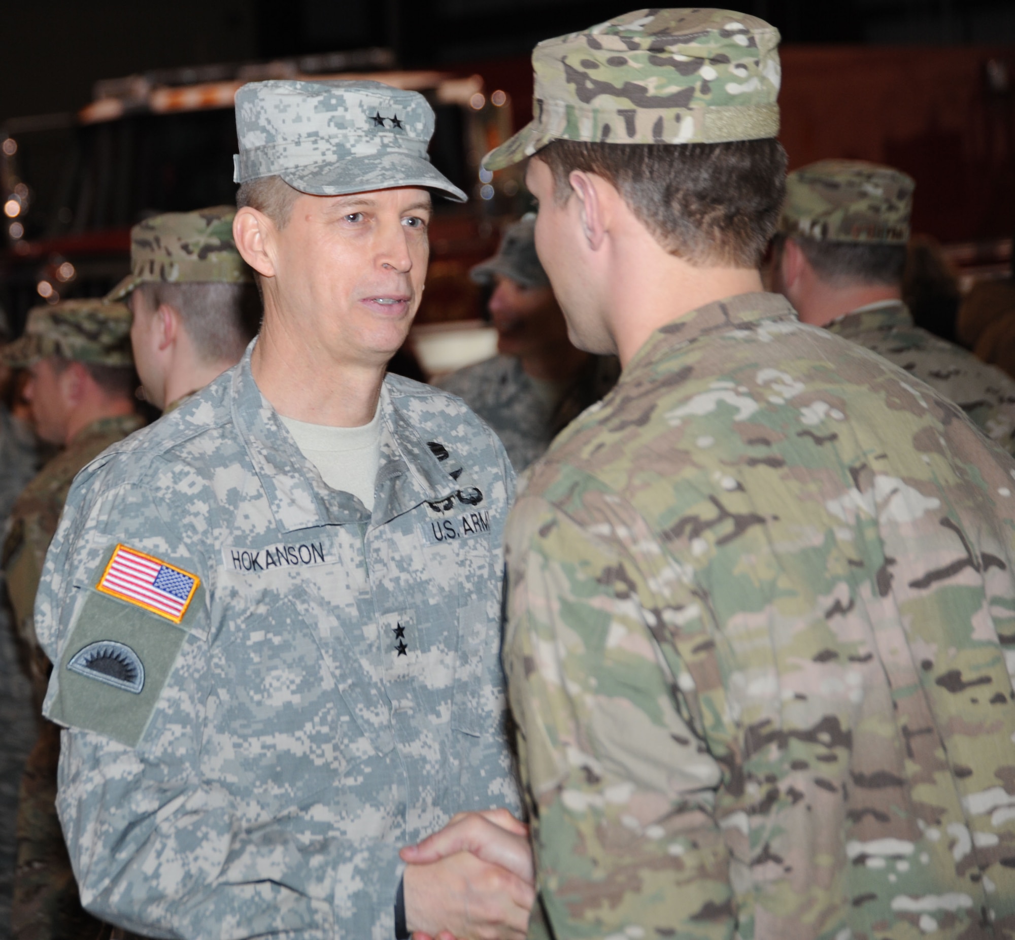 Maj. Gen. Daniel R. Hokanson, The Adjutant General for the State of Oregon, greets members of the 142nd CES, after a formal ceremony for their upcoming mobilization held at the Portland Air National Guard Base, Ore., March 1. (Air National Guard Photo by Tech. Sgt. Aaron Perkins, 142nd Fighter Wing Public Affairs/Released)