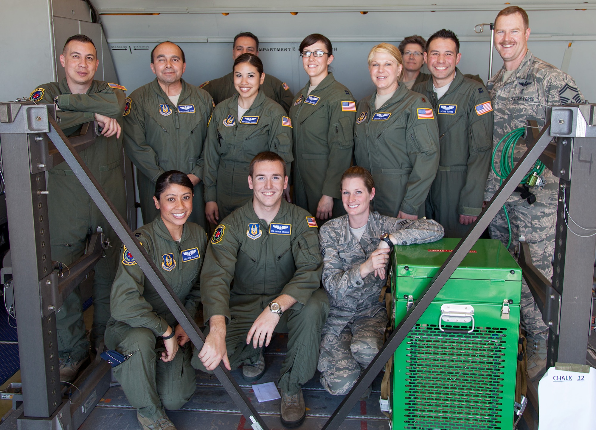 TRAVIS AIR FORCE BASE, Calif. -- Members of the 349th Aeromedical Evacuation Squadron pose for a group photo on board a KC-10A Extender at Travis Air Force Base, Calif., Feb. 23, 2014. Unlike the C-17 Globemaster III, the KC-10 was not designed with aeromedical evaluation in mind, but can be configured for the mission when needed. During the Unit Training Assembly of Feb. 22-23, squadrons from across the 349th Air Mobility Wing conducted interrelated exercise scenarios, providing Reservists opportunities to achieve core skill proficiency training. (U.S. Air Force photo / Lt. Col. Robert Couse-Baker)