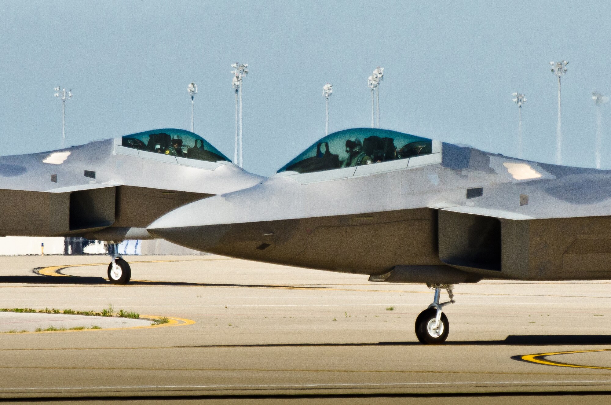 Two U.S. Air Force F-22 Raptor fighter jets taxi into the Kentucky Air National Guard Base in Louisville, Ky., on April 18, 2012. The Raptor Demonstration Team is set to appear in the 2014 Thunder Over Louisville Air Show. (U.S. Air National Guard photo by Maj. Dale Greer)
