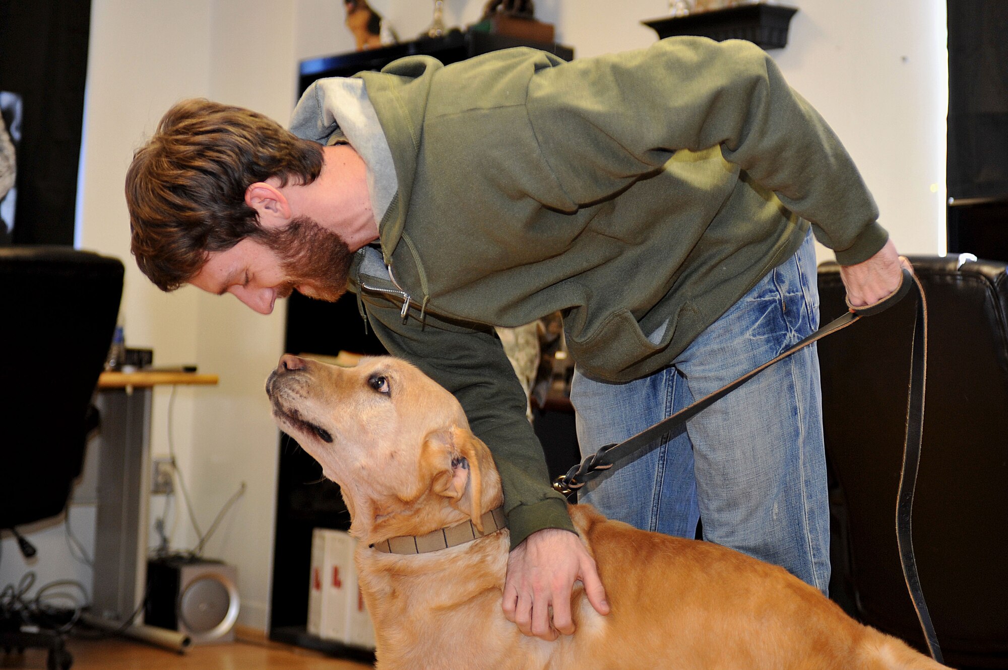 U.S. Army Sgt. John Nolan, former senior specialized-search dog handler previously assigned to the 3rd Military Police Detachment, greets his partner Honza, a 7-year-old SSD, after a two-month separation, at Fort Eustis, Va., Feb. 28, 2014.  Honza was Nolan’s only dog during his three years as an SSD handler. Nolan is a native of Wilkes-Barre, Pa.  ( (U.S. Air Force photo by Staff Sgt. Katie Gar Ward/Released)