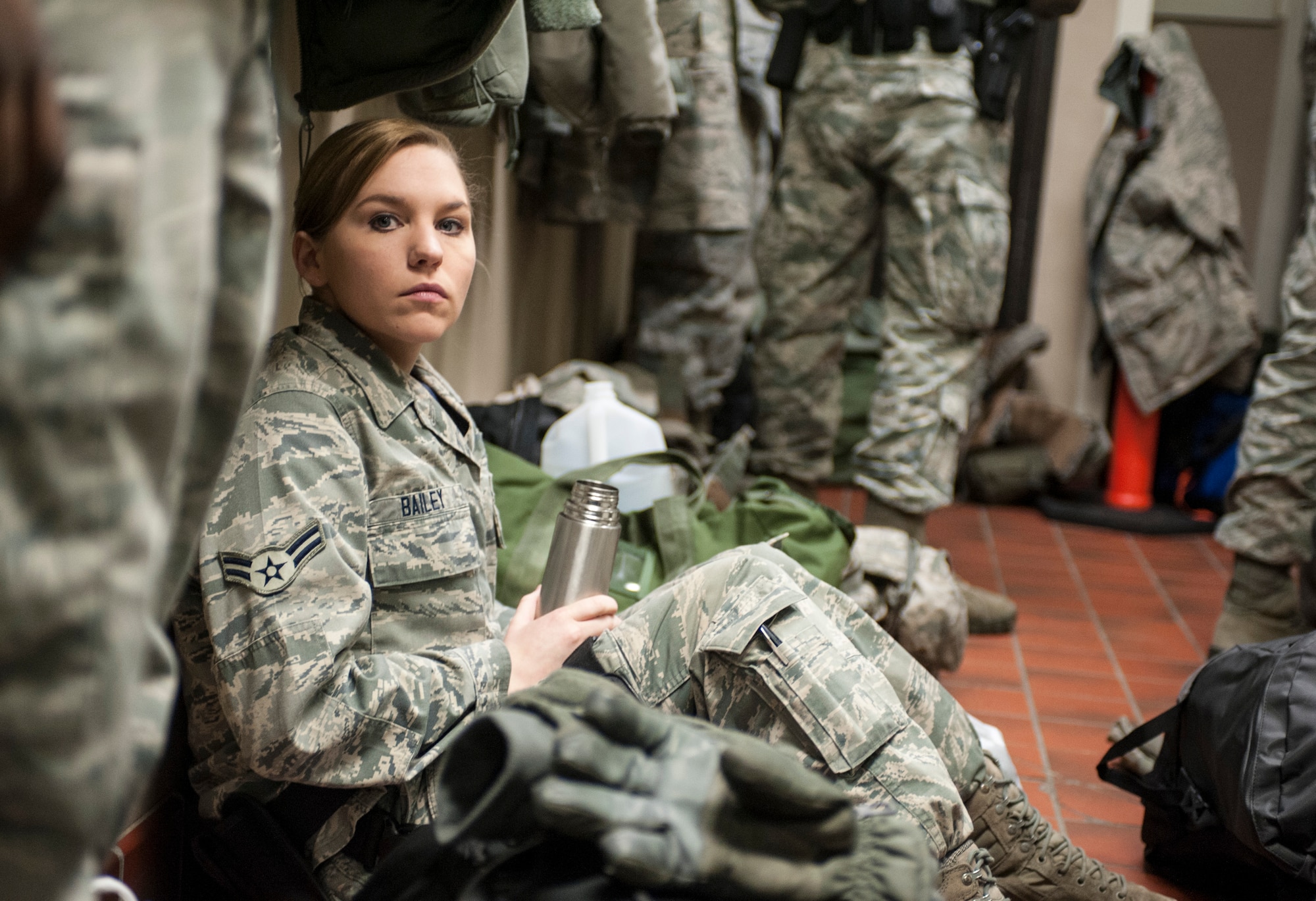 Airman 1st Class Phyllis Bailey, 5th Security Forces Squadron installation entry controller waits for guard mount to begin at Minot Air Force Base, N.D. Jan. 30. Guard mount is held between each change over and allows Airmen to receive daily briefings, perform function checks on their equipment and prepare to leave for their post. (U.S. Air Force photo/Senior Airman Stephanie Sauberan)