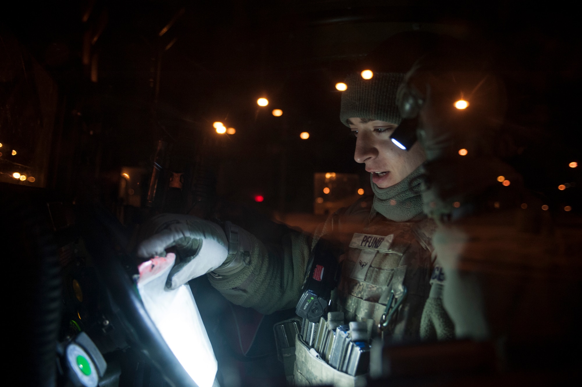 Airman Michael Pfund, 5th Security Forces Squadron response force member looks over documents while stationed in the Weapons Storage Area at Minot Air Force Base, N.D. Jan. 30. In addition to understanding technical manuals and paperwork 5th SFS Airmen acquire a vast amount of job knowledge and know an array of procedures as well as any information pertaining to the mission and security of the base. (U.S. Air Force photo/Senior Airman Stephanie Sauberan)