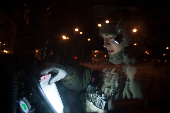 Airman Michael Pfund, 5th Security Forces Squadron response force member looks over documents while stationed in the Weapons Storage Area at Minot Air Force Base, N.D. Jan. 30. In addition to understanding technical manuals and paperwork 5th SFS Airmen acquire a vast amount of job knowledge and know an array of procedures as well as any information pertaining to the mission and security of the base. (U.S. Air Force photo/Senior Airman Stephanie Sauberan)