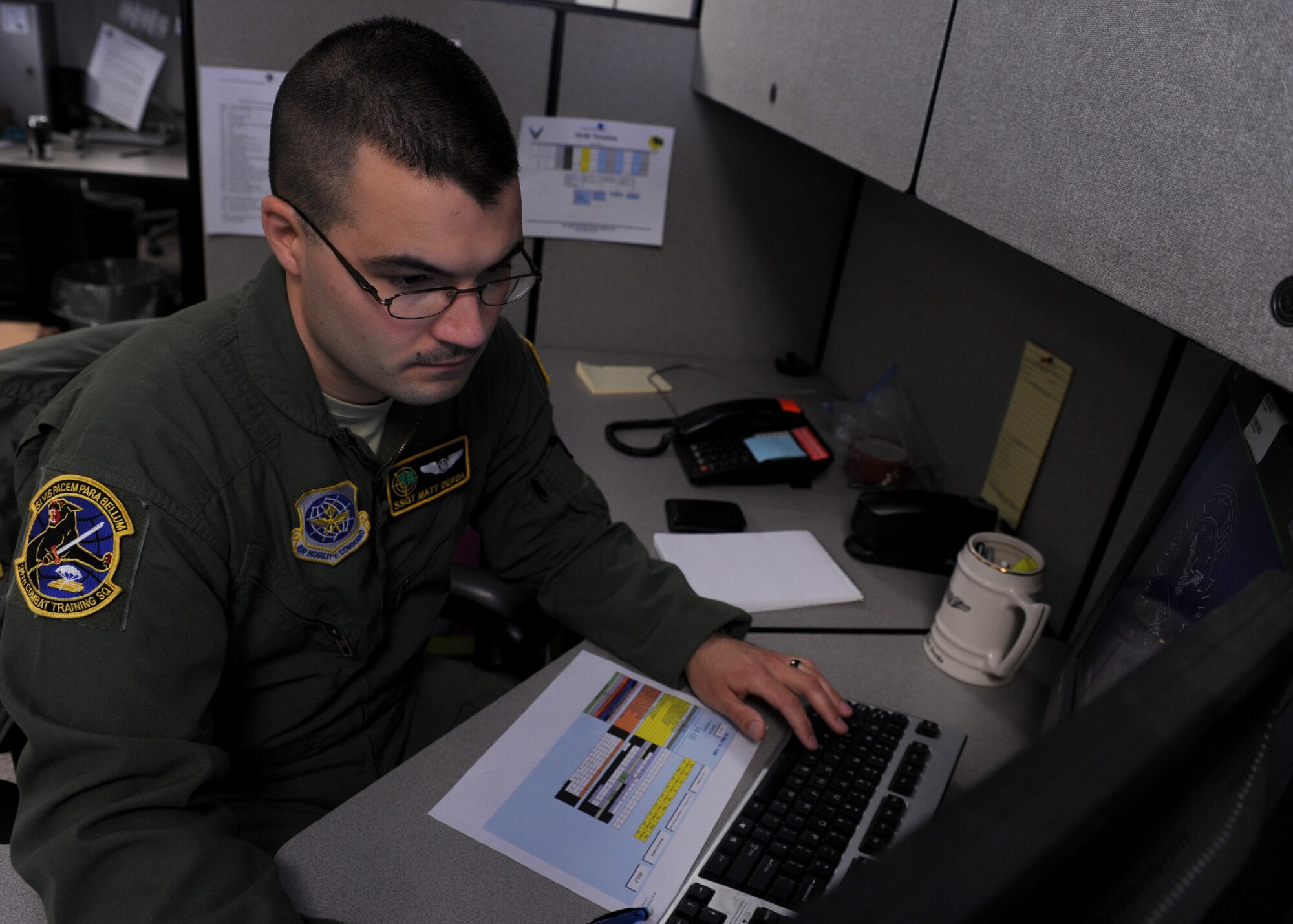 Staff Sgt. Matthew Derda, a 34th Combat Training Squadron instructor loadmaster, schedules a logistics plan for an upcoming exercise March 4, 2014, at Little Rock Air Force Base, Ark. Derda trained 21 C-130/ C-17 aircrew members across two Joint Readiness Training Center and  Green Flag Little Rock exercises helping prepare members for combat employment. (U.S. Air Force photo by Airman 1st Class Scott Poe)