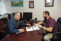 Ray Ramos (left) and Mike Bell, both community readiness consultants at the Joint
Base San Antonio-Randolph Military and Family Readiness Center, discuss the Boots
to Business program Monday. (U.S. Air Force photo by Joel Martinez)