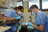 Lorna Firehammer (left), 359th Aerospace-Medicine Squadron Dental Flight dental assistant, helps Lt. Col. James Kutner, 359th AMDS Dental Flight commander, during a procedure Jan. 22 at the Joint Base San Antonio- Randolph Dental Clinic. (U.S. Air Force photo by Rich McFadden)