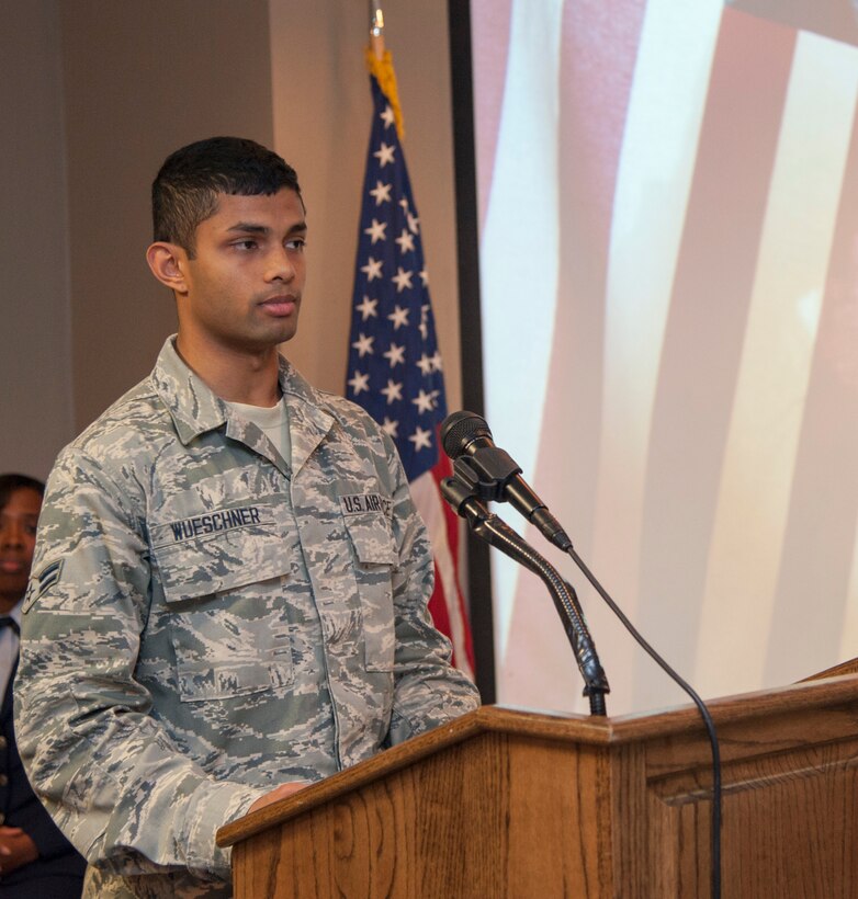 Airman 1st Class Esala Wueschner, 47th Force Support Squadron Commander Support Staff personnel journeyman, gives a Buddhist Prayer during the National Prayer Luncheon at Club XL on Laughlin Air Force Base, Texas, Feb. 27, 2014. Different religious prayers were given to help build unity within those in attendance. (U.S. Air Force photo/Airman 1st Class Jimmie D. Pike)