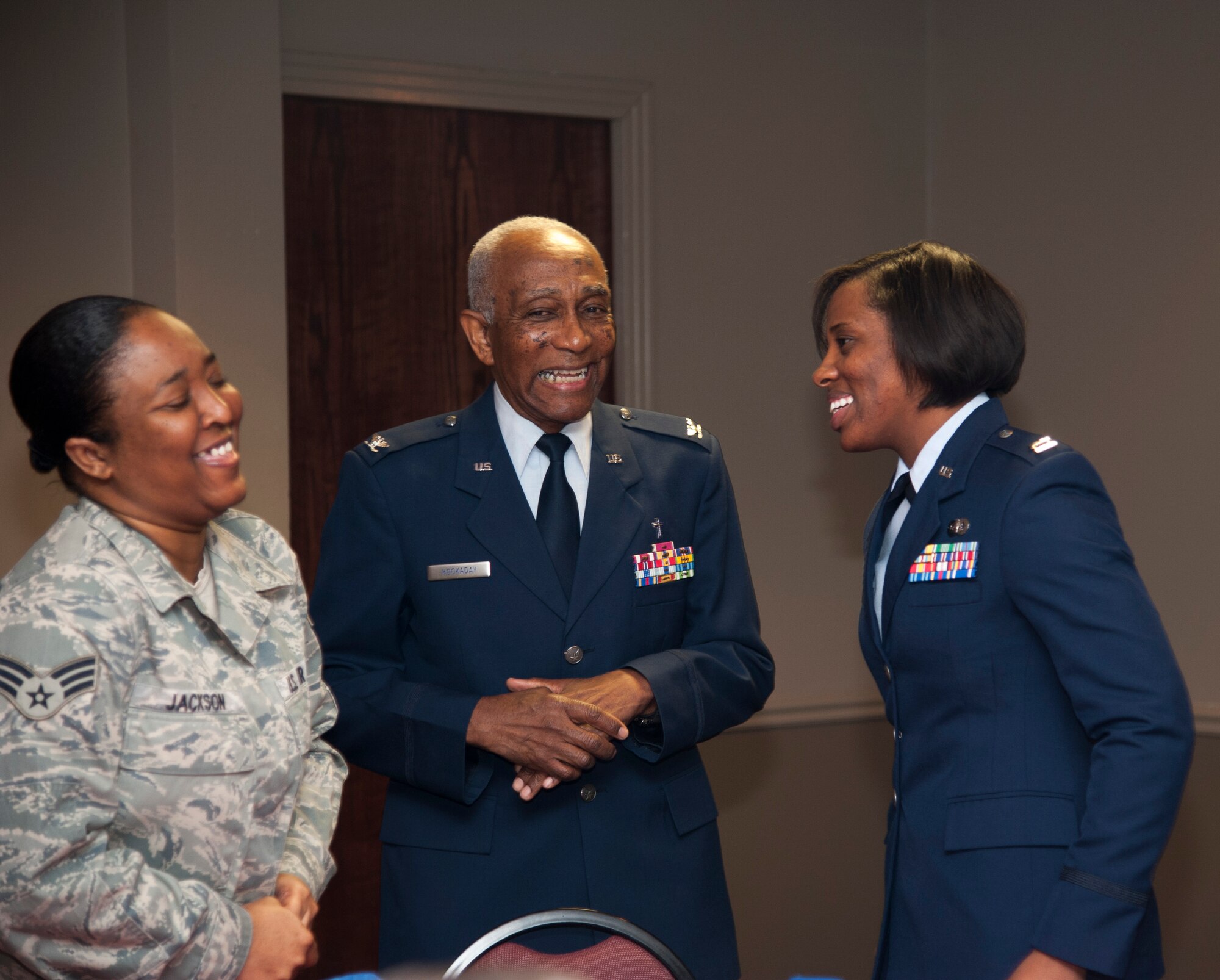 Senior Airman Anesha Jackson, 47th Communications Squadron client service technician, left, Capt. Fenesha Friar, 47th Mission Support Group executive officer, right, and retired Chaplain (Col.) Al Hockaday, share a laugh during Laughlin’s annual National Prayer Luncheon at Club XL on Laughlin Air Force Base, Texas, Feb. 27, 2014. The Prayer Luncheon is an annual event to remind Airmen of the importance of prayer. (U.S. Air Force photo/Airman 1st Class Jimmie D. Pike) 
