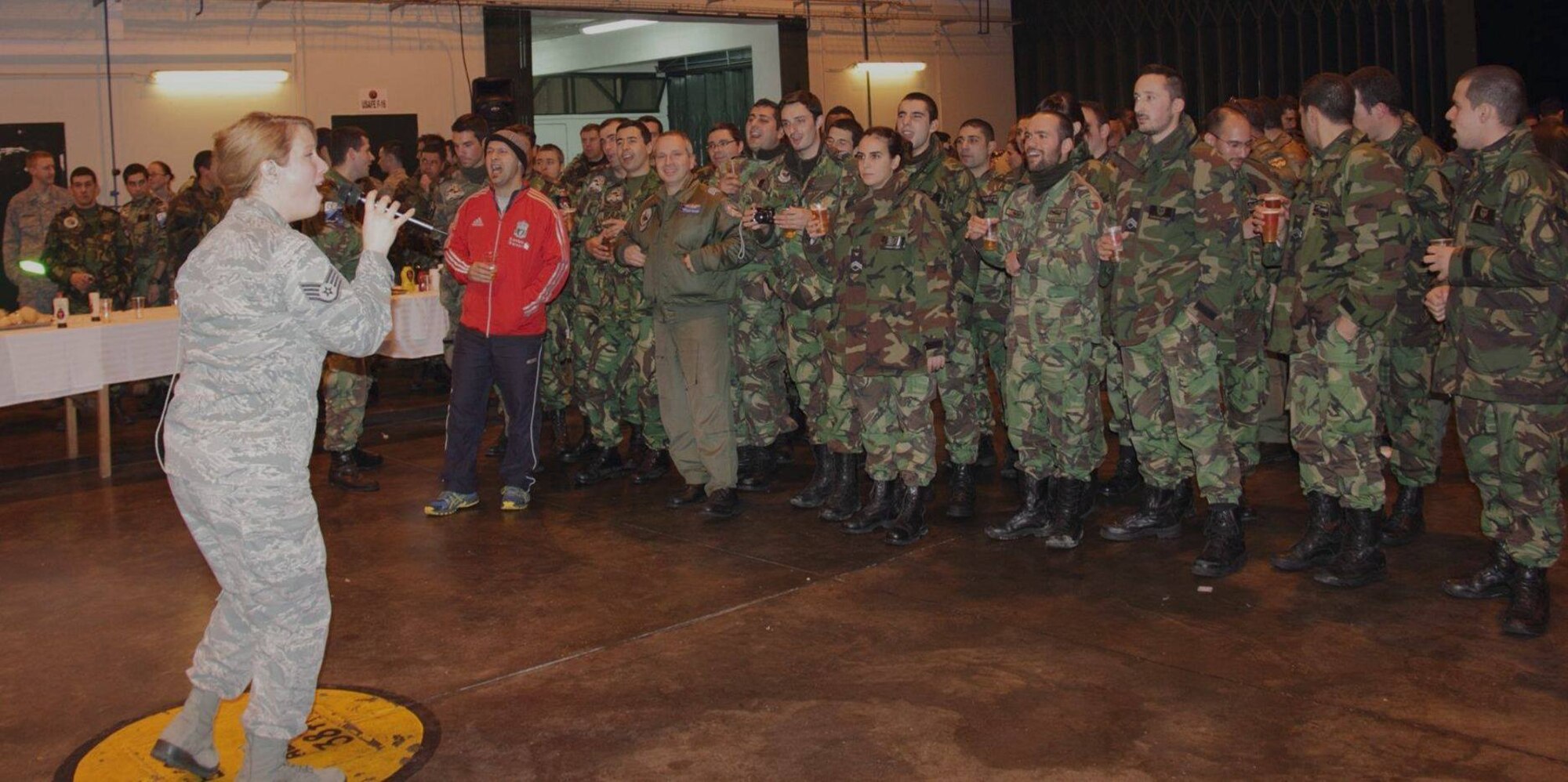 "The U.S. Air Forces in Europe Band's popular music group, Touch 'n Go, performed during the inaugural year of REAL THAW on Feb. 13, 2014, at Monte Real Air Base, Portugal.  Staff Sergaent Jill Diem (pictured) encourages audience particiaption.