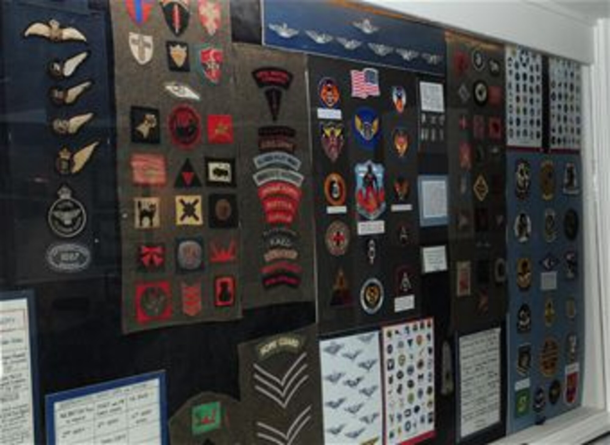 Stripes, patches and other U.S. Air Force memorabilia are on display inside the "Airmen's Bar" at The Swan in Lavenham, Suffolk. The former inn, now a hotel, was a favourite haunt for American Airmen who were stationed at local bases during World War II, the nearest being the 487th Bomb Group in Lavenham. The town is proud of its ties and long relationship with the U.S. Air Force, and the American flag is on display in the local church, honouring those fallen in World War II. (U.S. Air Force photo by Karen Abeyasekere/Released)