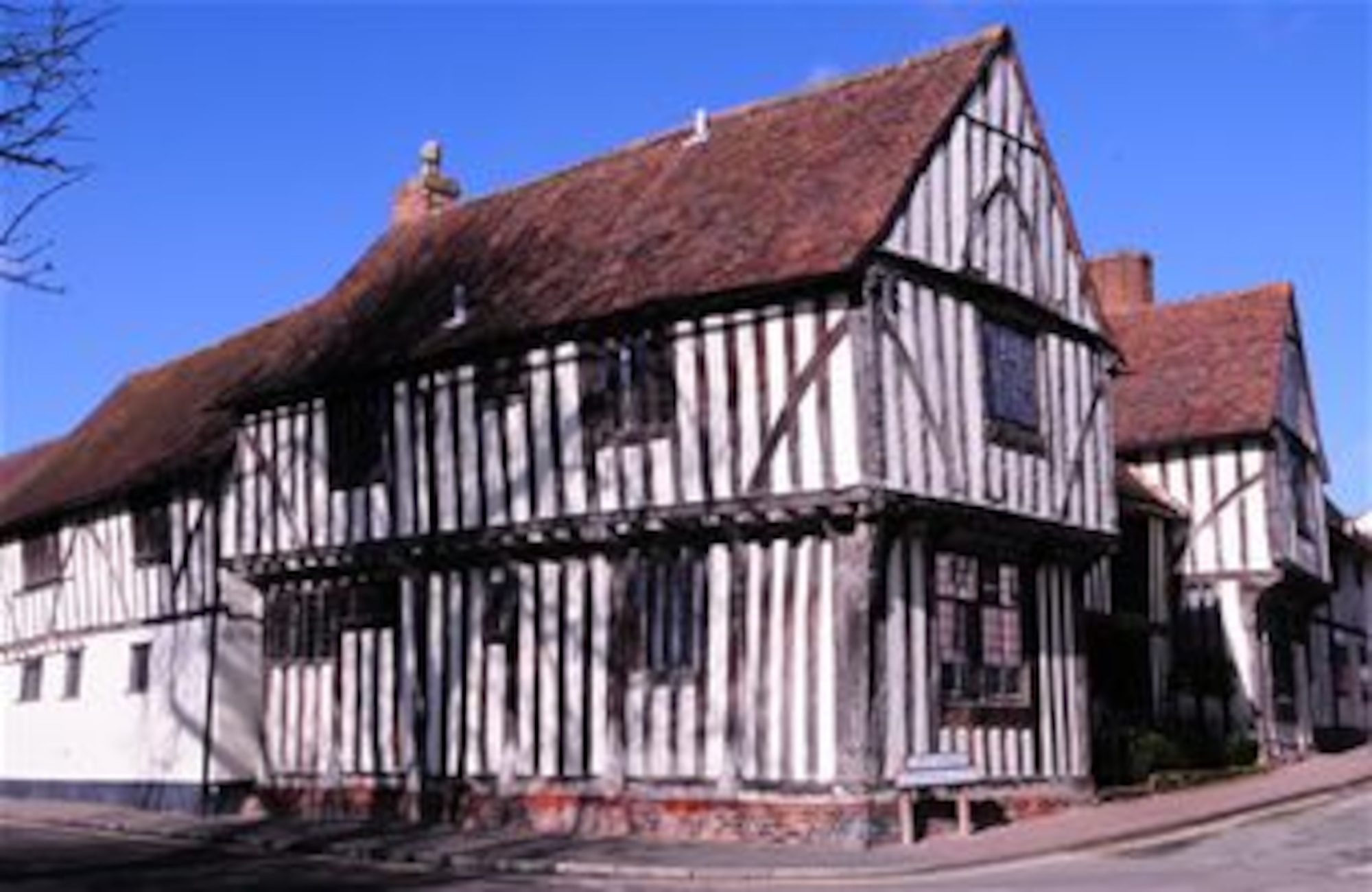 The Wool Hall in Lavenham, Suffolk, is one of many half-timbered buildings in the town and is a tribute to the source of the English wool trade. During the Middle Ages, Lavenham was well known in the wool trade, and prosperous wool merchants are responsible for most of the town's memorable buildings. The picturesque town is quintessentially English. Cafes, antique shops, small boutiques and those selling fresh, local produce are all located along the High Street. (U.S. Air Force photo by Karen Abeyasekere/Released)