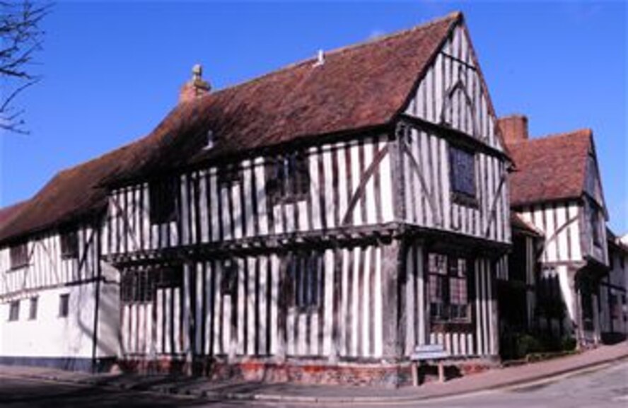 The Wool Hall in Lavenham, Suffolk, is one of many half-timbered buildings in the town and is a tribute to the source of the English wool trade. During the Middle Ages, Lavenham was well known in the wool trade, and prosperous wool merchants are responsible for most of the town's memorable buildings. The picturesque town is quintessentially English. Cafes, antique shops, small boutiques and those selling fresh, local produce are all located along the High Street. (U.S. Air Force photo by Karen Abeyasekere/Released)