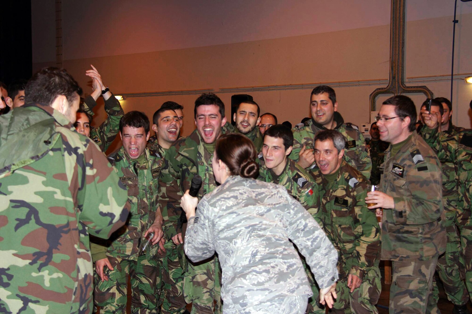 "The U.S. Air Forces in Europe Band's popular music group, Touch 'n Go, performed during the inaugural year of REAL THAW on Feb. 13, 2014, at Monte Real Air Base, Portugal.   The REAL THAW exercise included approximately 4000 military personnel and 44 planes from the U.S., Portugal, Netherlands and NATO. Featured in the photo is SrA Melissa Lackore, one of USAFE Band's Touch 'n Go vocalist. (Photo courtesy Monte Real Air Base Public Affairs)"
