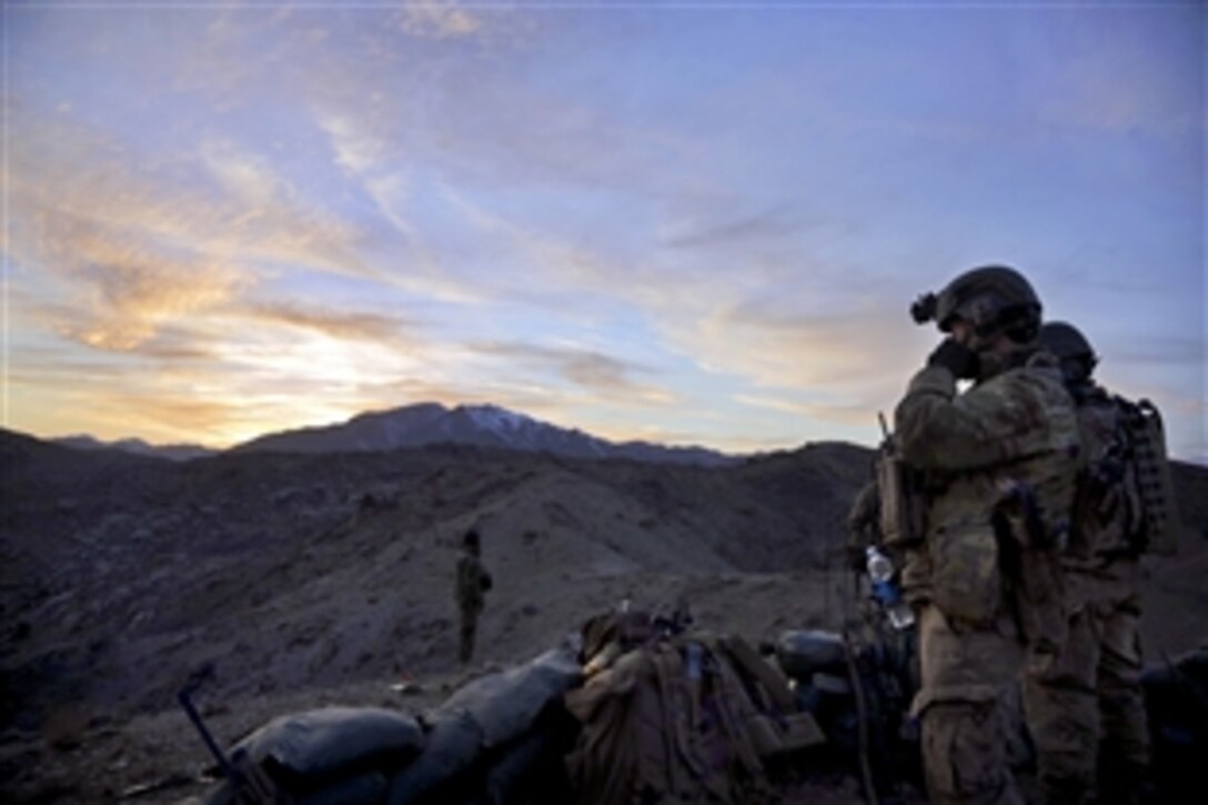 A U.S. Special Forces soldier talks on his radio after successfully completing a clearing operation in Darazkol village in Afghanistan's Kandahar province, Feb. 23, 2014. The U.S. soldiers, assigned to Special Forces Operational Detachment Afghanistan, assisted Afghan commandos with clearing operations to disrupt insurgents from using Kharkrezwal village as a safe haven.