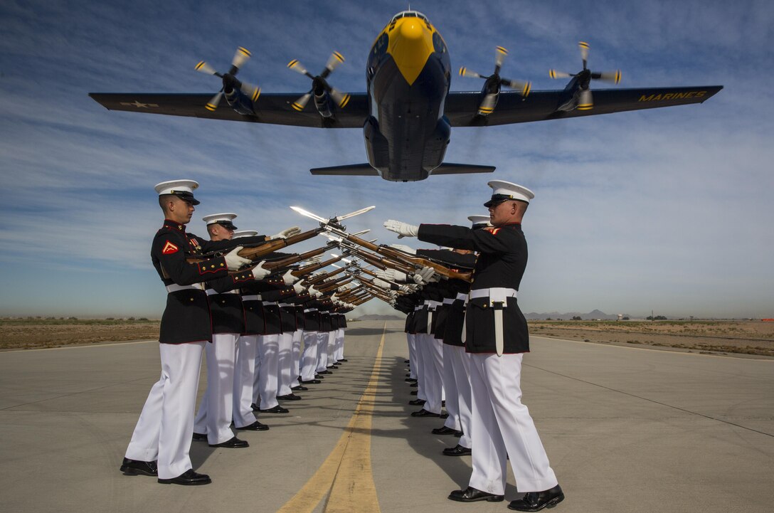 Fat Albert, a C-130 Hercules, which is apart of the Blue Angels, files over the Silent Drill Platoon at Marine Corps Air Station Yuma, Ariz., March 4. (U.S. Marine Corps photo by Cpl. Zachary Scanlon/released)