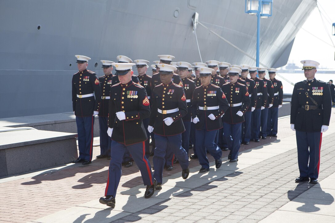 US Marines with Combat Logistics Regiment 25, 2nd Marine Logistics Group, run aboard the USS Somerset (LPD 25) after being given the command by the ships sponsor, Mary Jo Myers, March 1, 2014 at Penn's Landing, Philadelphia, Pa. It is tradition at commissioning ceremonies for the ships sponsor to give the command, "Man the ship and bring her to life!" (U.S. Marine Corps photo by Cpl. William M. Kresse / Released)