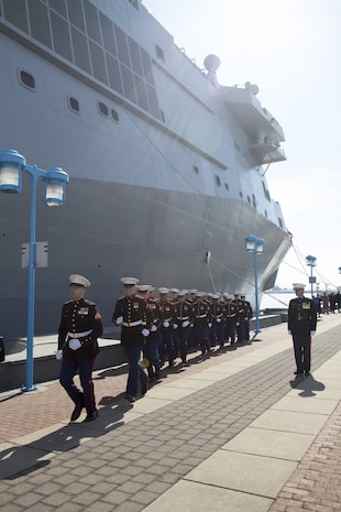 US Marines with Combat Logistics Regiment 25, 2nd Marine Logistics Group, run aboard the USS Somerset (LPD 25) after being given the command by the ships sponsor, Mary Jo Myers, March 1, 2014 at Penn's Landing, Philadelphia, Pa. It is tradition at commissioning ceremonies for the ships sponsor to give the command, "Man the ship and bring her to life!" (U.S. Marine Corps photo by Cpl. William M. Kresse / Released)