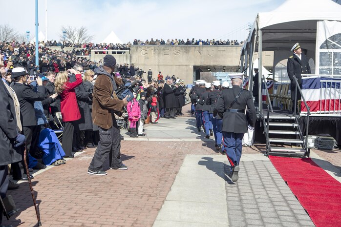 US Marines with Combat Logistics Regiment 25, 2nd Marine Logistics Group, run aboard the USS Somerset (LPD 25) after being given the command by the ships sponsor, Mary Jo Myers, March 1, 2014 at Penn's Landing, Philadelphia, Pa. It is tradition at commissioning ceremonies for the ships sponsor to give the command, "Man the ship and bring her to life!" (U.S. Marine Corps photo by Cpl. William M. Kresse / Released)
