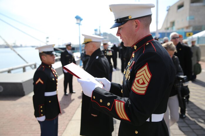 First Sgt. Leon M. Banta (right), an Oil City, Pa., native and the senior enlisted advisor for the Marine detachment at the USS Somerset Commissioning Ceremony, reads the promotion warrant for Lance Cpl. Uriel Reyes Jr., a Santa Ana, Calif., native and school clerk for Headquarters and Support Company, 8th Engineer Support Battalion, 2nd Marine Logistics Group, following the commissioning ceremony of the USS Somerset at Penn’s Landing, Philadelphia, March 1, 2014. Gen. James F. Amos, the 35th Commandant of the Marine Corps, promoted Reyes from private first class to lance corporal just outside the ship. 