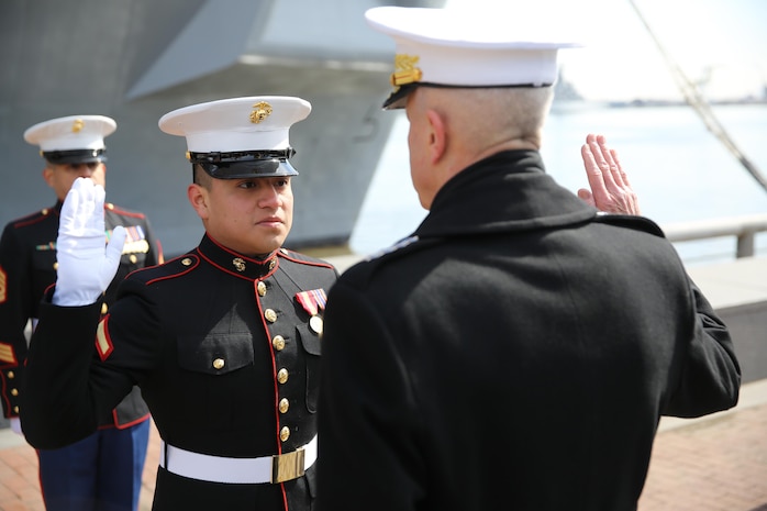 Gen. James F. Amos (right), the 35th Commandant of the Marine Corps, gives the oath of enlistment to Lance Cpl. Uriel Reyes Jr. (left), a Santa Ana, Calif., native and school clerk for Headquarters and Support Company, 8th Engineer Support Battalion, 2nd Marine Logistics Group, during a promotion ceremony at Penn’s Landing, Philadelphia, March 1, 2014. The commandant promoted Reyes after the commissioning ceremony for the USS Somerset, named in honor of the passengers of United Airlines Flight 93, who fought terrorist attempts to hijack their plane on Sept. 11, 2001. 