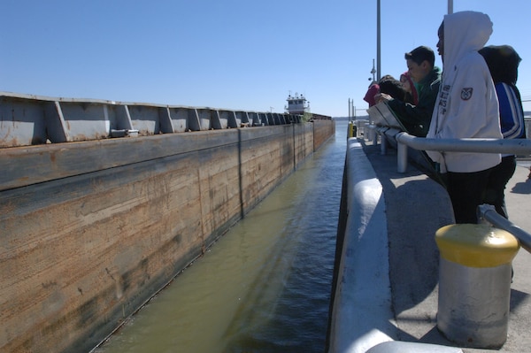 Stratford STEM Magnet High School ninth graders watch a six-barge tow navigate through Old Hickory Lock Feb. 27, 2014 during a field trip at the U.S. Army Corps of Engineers project located on the Cumberland River in Old Hickory, Tenn.