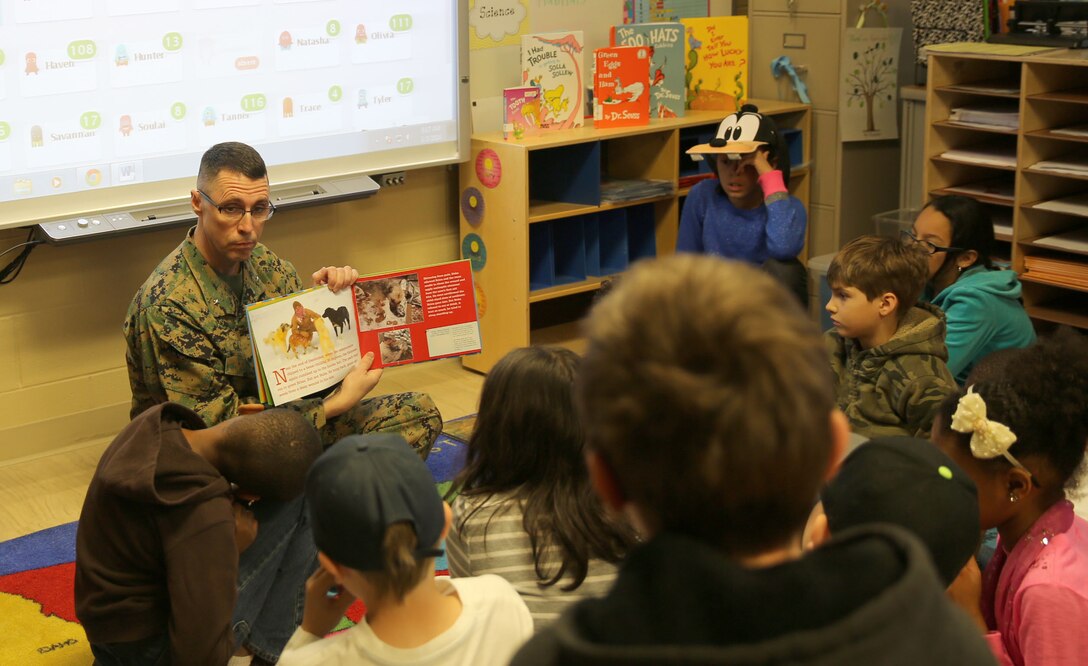 Brig. Gen. Robert F. Castellvi, the commanding general of Marine Corps Base Camp Lejeune, reads to a 4th grade class at Tarawa Terrace Elementary School aboard Marine Corps Base Camp Lejeune, Monday. Castellvi visited the school to support Read Across America Day, an annual nationwide literacy event. “I am so proud to be a part of this program,” said Castellvi. “Reading sets the foundation for all learning. An enthusiasm for reading in our kids can start a spark that will ignite a thirst for knowledge and set them up for the future.”
