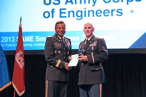 Lt. Gen. Thomas Bostick (left), commanding general of the U.S. Army Corps of Engineers, presents the AbilityOne Award to Col. Alan Dodd, commander of Jacksonville District, at the 2013 Society of American Military Engineers Small Business Conference in Kansas City, Mo. The district was recognized for awarding $2.9 million in contracts to AbilityOne nonprofit agencies, the second highest dollar amount awarded to AbilityOne contractors by a Corps district. 