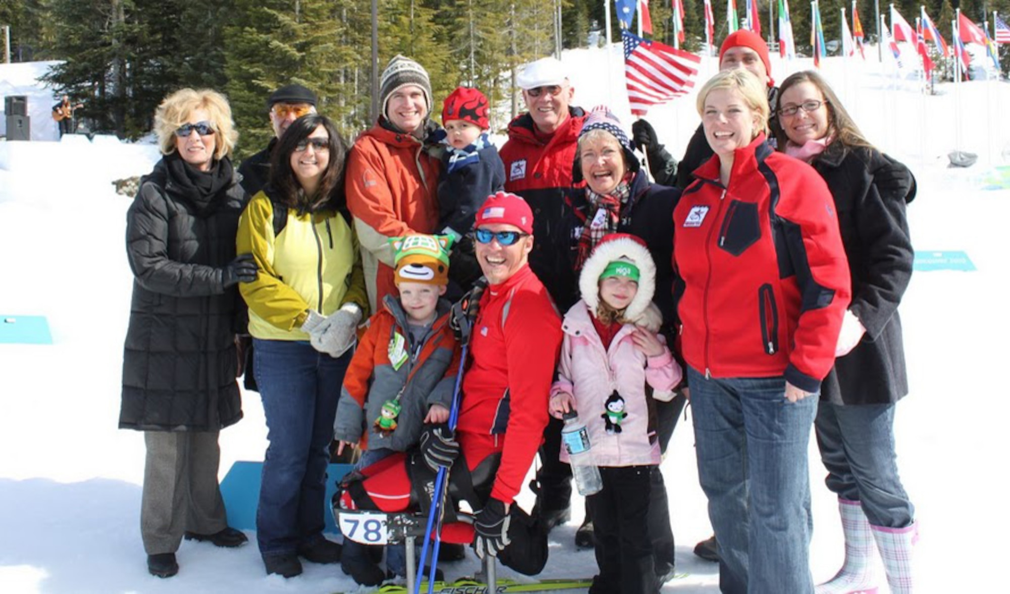 Surrounded by his family, Sean Halsted poses for a picture during the 2010 Vancouver Paralympic Winter Games.   Halsted, a former senior airman, was injured during a training exercise in 1998.  He is scheduled to compete in the Sochi Paralympic Winter Games starting on March 6, 2014. (Courtesy photo/Tech. Sgt. Regan Halsted)