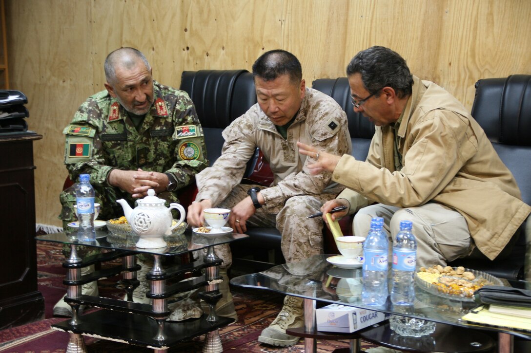 Brigadier Gen. Daniel D. Yoo, center, Regional Command (Southwest) commanding general, discusses the upcoming Afghan presidential elections with 215th Corps Chief of Staff, Brig. Gen. Zamen Hassan, left, during a security shura held aboard Forward Operating Base Delaram, Nimroz province, Afghanistan, March 4, 2014. They also discussed the polling stations and the security measures they are preparing in order to keep the people of Nimroz province safe.