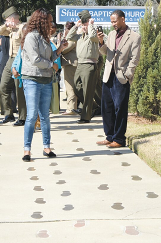 A base employee retraces footprints of the Albany civil rights movement outside of the Shiloh Baptist Church in Albany, Ga., Feb. 28 during a professional military education tour at the Albany Civil Rights Institute.