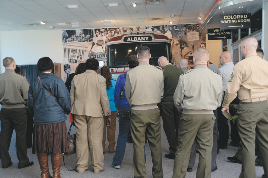 About 50 base personnel view a wall containing information about the civil rights movement during a professional military education tour Feb. 28 at the Albany Civil Rights Institute, Albany, Ga.