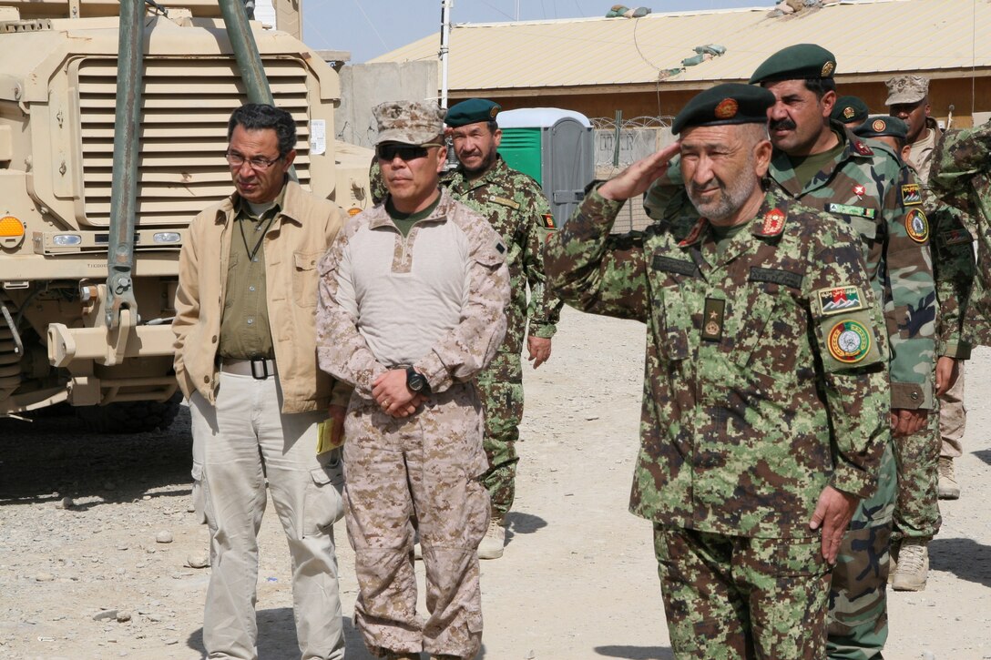 Brigadier Gen. Daniel D. Yoo, center, Regional Command (Southwest) commanding general, observes a formation of Afghan National Army's 4th Brigade, 215th Corps soldiers held during a security shura aboard Forward Operating Base Delaram, Nimroz province, Afghanistan, March 4, 2014. During the shura, Brig. Gen. Yoo, Marine Expeditionary Brigade - Afghanistan staff, Marines with Security Force Assistance Advisor Team 4-215 and Afghan officials discussed the upcoming presidential election and security measures being emplaced to ensure the safety of the local people.