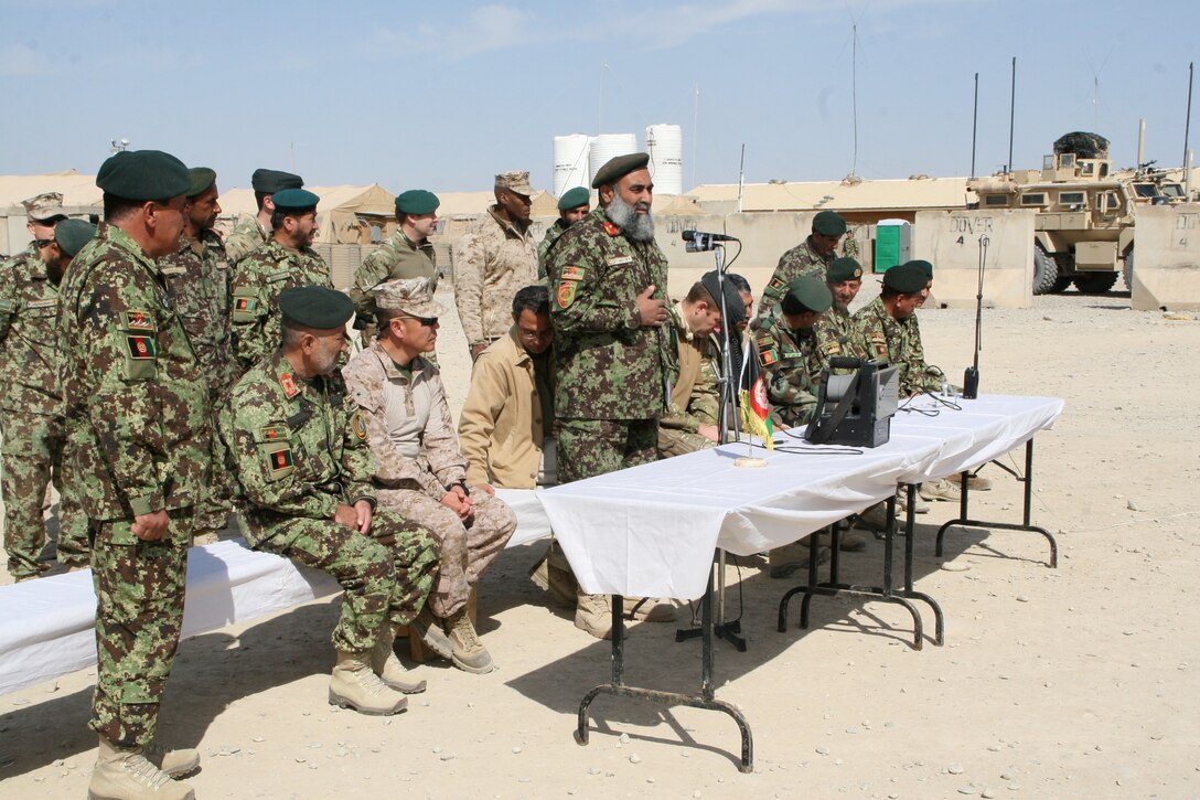 Brigadier Gen. Daniel D. Yoo, center, Regional Command (Southwest) commanding general, observes a formation of Afghan National Army's 4th Brigade, 215th Corps soldiers held during a security shura aboard Forward Operating Base Delaram, Nimroz province, Afghanistan, March 4, 2014. During the shura, Brig. Gen. Yoo, Marine Expeditionary Brigade - Afghanistan staff, Marines with Security Force Assistance Advisor Team 4-215 and Afghan officials discussed the upcoming presidential election and security measures being emplaced to ensure the safety of the local people.
