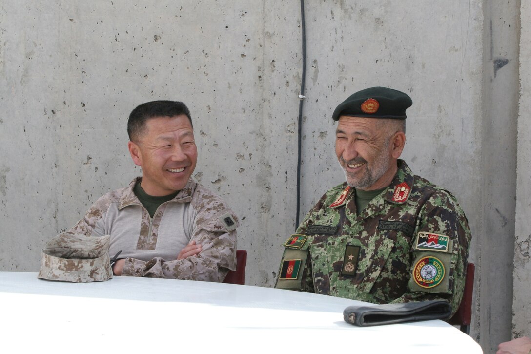 Brigadier Gen. Daniel D. Yoo, left, Regional Command (Southwest) commanding general, sits with 215th Corps Chief of Staff, Brig. Gen. Zamen Hassan, left, as they discuss the upcoming Afghan presidential elections during a security shura held aboard Forward Operating Base Delaram, Nimroz province, Afghanistan, March 4, 2014. They also discussed the polling stations and the security measures they are preparing in order to keep the people of Nimroz province safe.