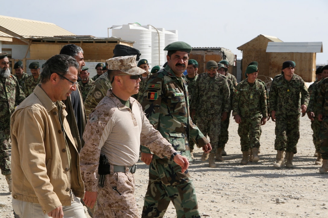 Brigadier Gen. Daniel D. Yoo, center, Regional Command (Southwest) commanding general, observes a formation of Afghan National Army's 4th Brigade, 215th Corps soldiers held during a security shura aboard Forward Operating Base Delaram, Nimroz province, Afghanistan, March 4, 2014. During the shura, Brig. Gen. Yoo, Marine Expeditionary Brigade - Afghanistan staff, Marines with Security Force Assistance Advisor Team 4-215 and Afghan officials discussed the upcoming presidential election and security measures being emplaced to ensure the safety of the local people.