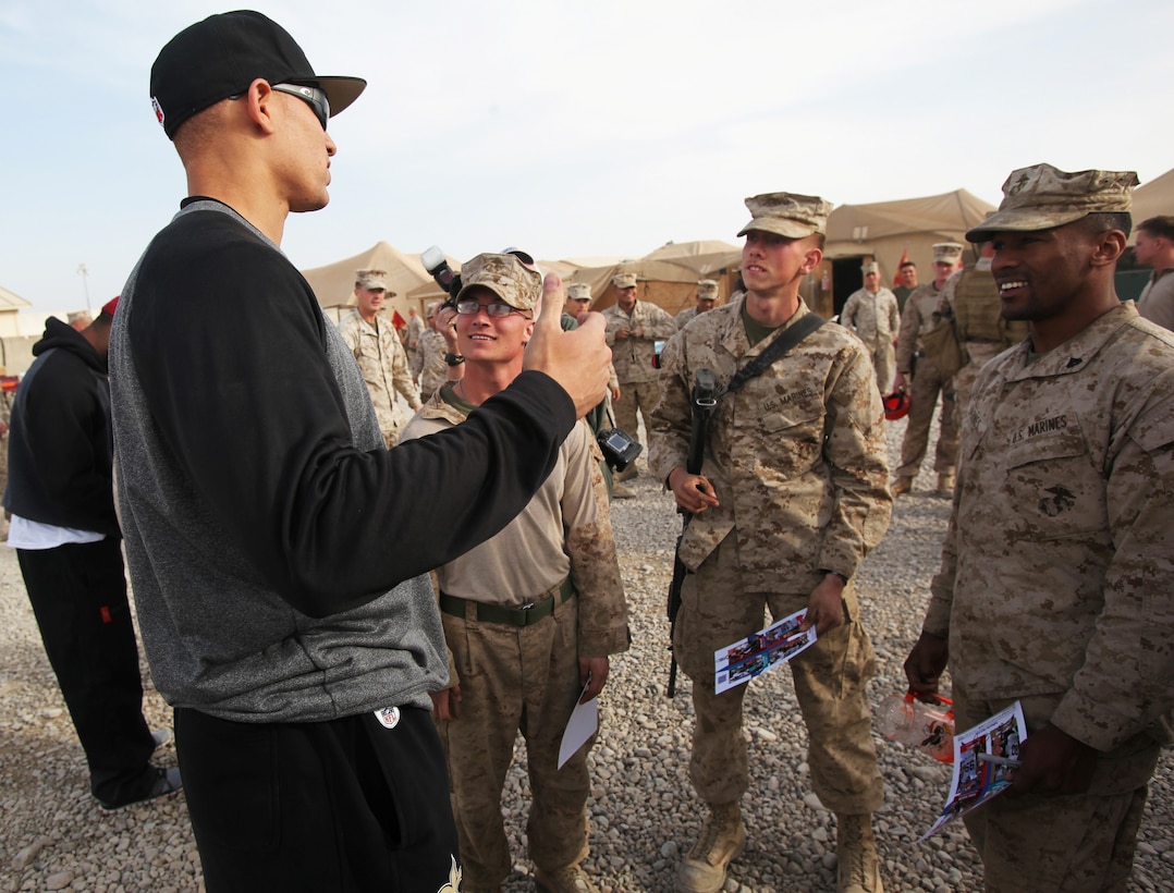 New Orleans Saints tight end Jimmy Graham talks to Marines with Regional Command (Southwest) during a USO-sponsored tour to Camp Leatherneck, Afghanistan, March 3, 2014. Three NFL players volunteered for the tour to support troops serving in Operation Enduring Freedom. (U.S. Marine Corps photo by Cpl. Cody Haas/ Released)