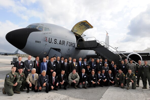 U.S. Air Force Brig. Gen. James Hecker, 18th Wing commander, poses for a group photo with members of the Japan-American Air Force Goodwill Association in front of a KC-135 Stratotanker on Kadena Air Base, Japan, March 5, 2014. During the visit, Kadena Airmen briefed JAAGA members from mainland Japan on the different capabilities the base provides as they toured different aircraft from the F-15 Eagle and F-22 Raptor to the HH-60 Pave Hawk helicopter and KC-135 Stratotanker. (U.S. Air Force photo by Senior Airman Maeson L. Elleman)