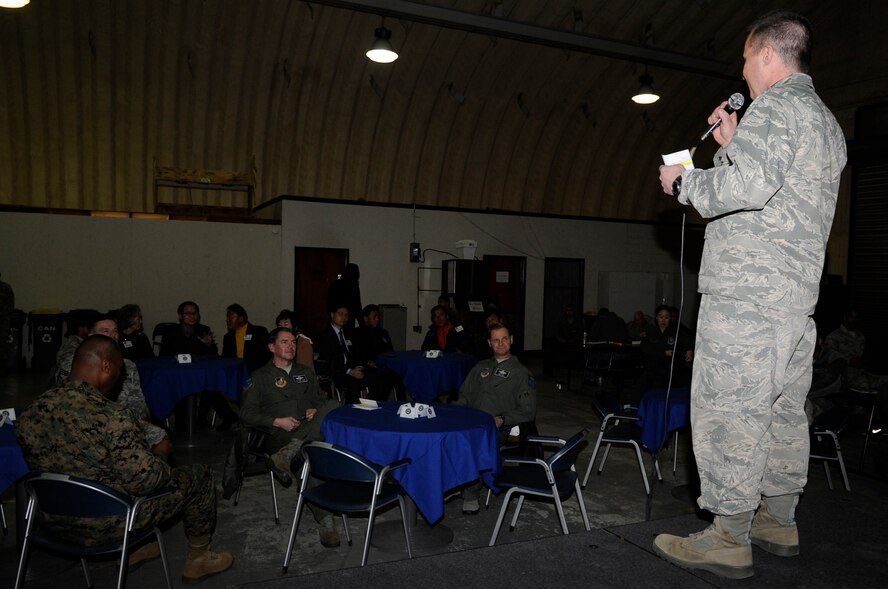 U.S. Air Force Maj. Jason Smith, Korea Air Simulation Center director, thanks the augmented forces who assisted during Exercise Key Resolve 2014. The exercise was designed to improve the combat readiness posture of the ROK-US Alliance and strengthen their combined operational capabilities. (U.S. Air Force photo/Senior Airman Marcus Morris)