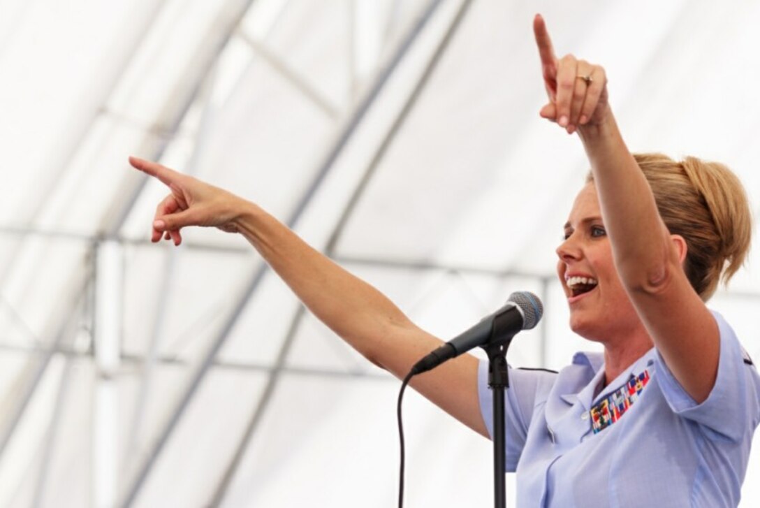 CHANGI, Singapore – Master Sergeant Lara Murdzia, Band of the Pacific-Hawaii, encourages the crowd to sing along at the Singapore Air Show, Feb. 16, 2014. The group played 9 shows to over 100K audience members throughout their tour. The Band of the Pacific-Hawaii went to Singapore in support of the air show, the U.S. Embassy, and to improve international relations. (Photo by: Seven Zhan/released) 