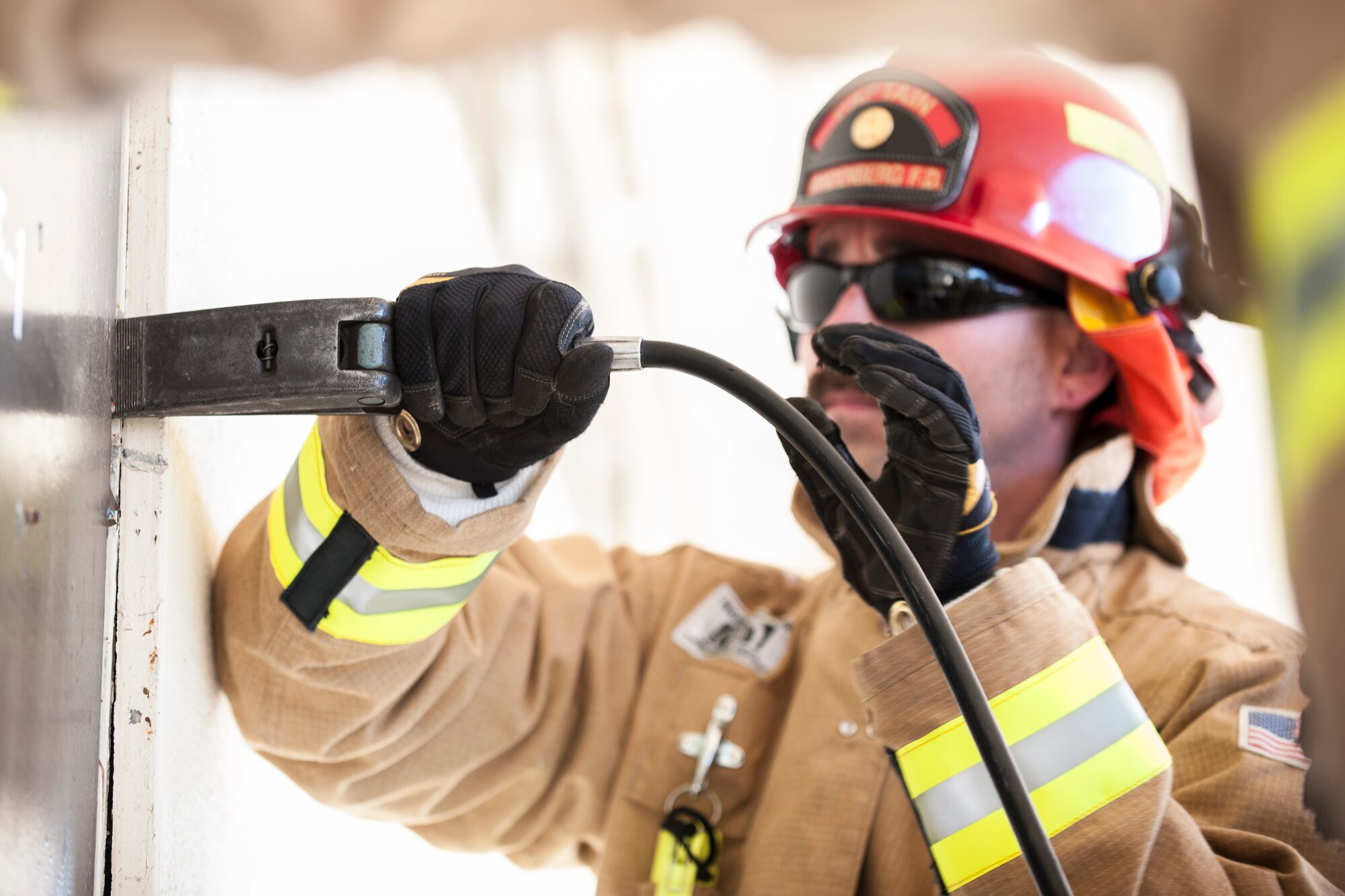 VANDENBERG AIR FORCE BASE, Calif. – Jesse Hendricks, 30th Civil Engineering Squadron captain, performs a forced entry technique here Feb. 11. Military and civilian firefighters along with the Hot Shots got an opportunity to perform different skills on the old education building set to be demolished within the next few months. U.S. Air Force photo/Airman 1st Class Yvonne Morales) 