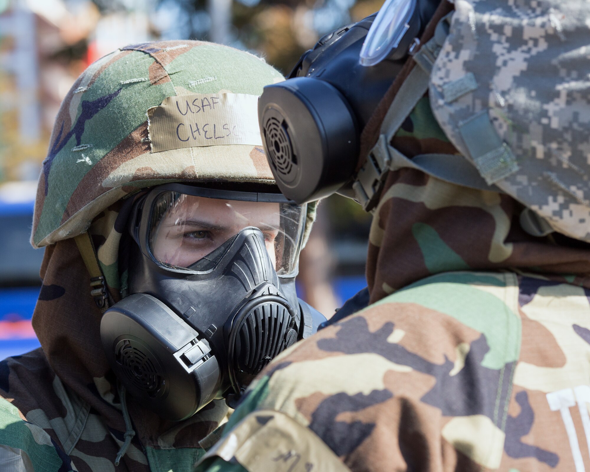 Airmen from the 374th Civil Engineer Squadron don their gas masks during a Samurai Readiness Inspection at Yokota Air Base, Japan, March 6, 2014. The readiness inspection was designed to evaluate areas such as rapid mobility response to simulated contingencies and providing airlift support to military and non-combatant evacuation. (U.S. Air Force photo by Osakabe Yasuo/Released) 