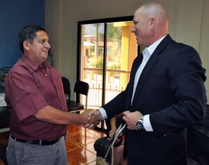 U.S. Army Col. Thomas Boccardi is greeted by Mario Palencia, Mayor of Ajuterique, during a visit to Ajuterique, Honduras, March 5, 2014.  Boccardi spent the afternoon visiting with local leaders and discussing building on the strong relationship between Joint Task Force-Bravo and the local communities surrounding Soto Cano Air Base. Boccardi also presented the mayor with a collection of soccer balls and jerseys on behalf of the non-profit organization "Kick for Nick."(U.S. Air Force photo by Capt. Zach Anderson)   (U.S. Air Force photo by Capt. Zach Anderson)